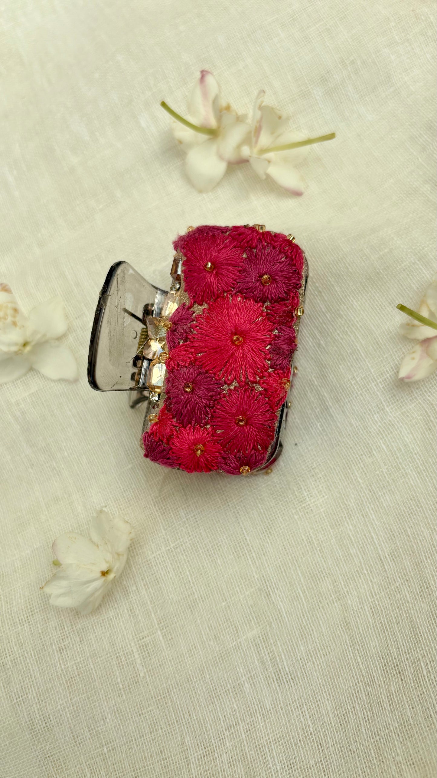 Embroidered clutcher