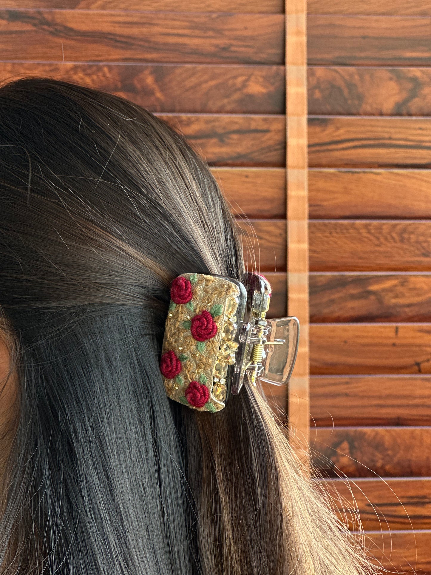 Embroidered clutcher