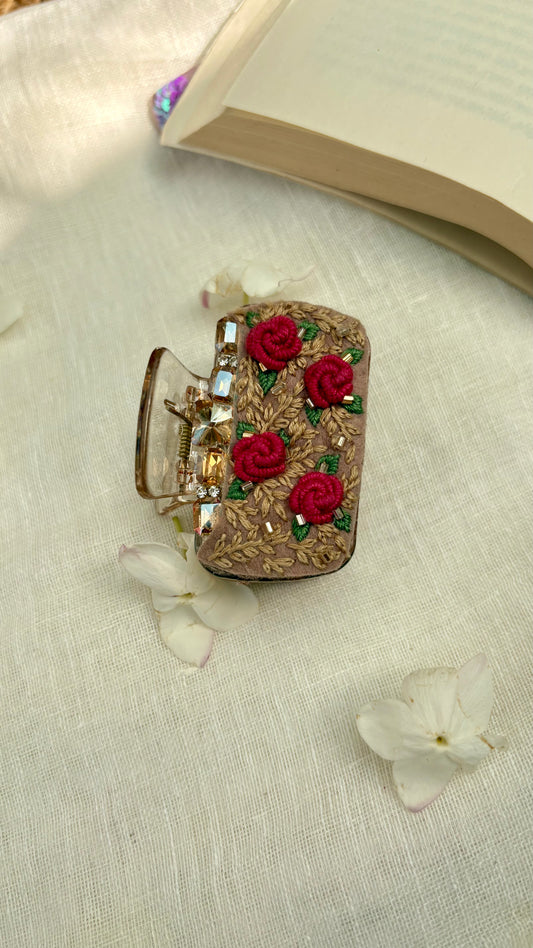 Embroidered clutcher