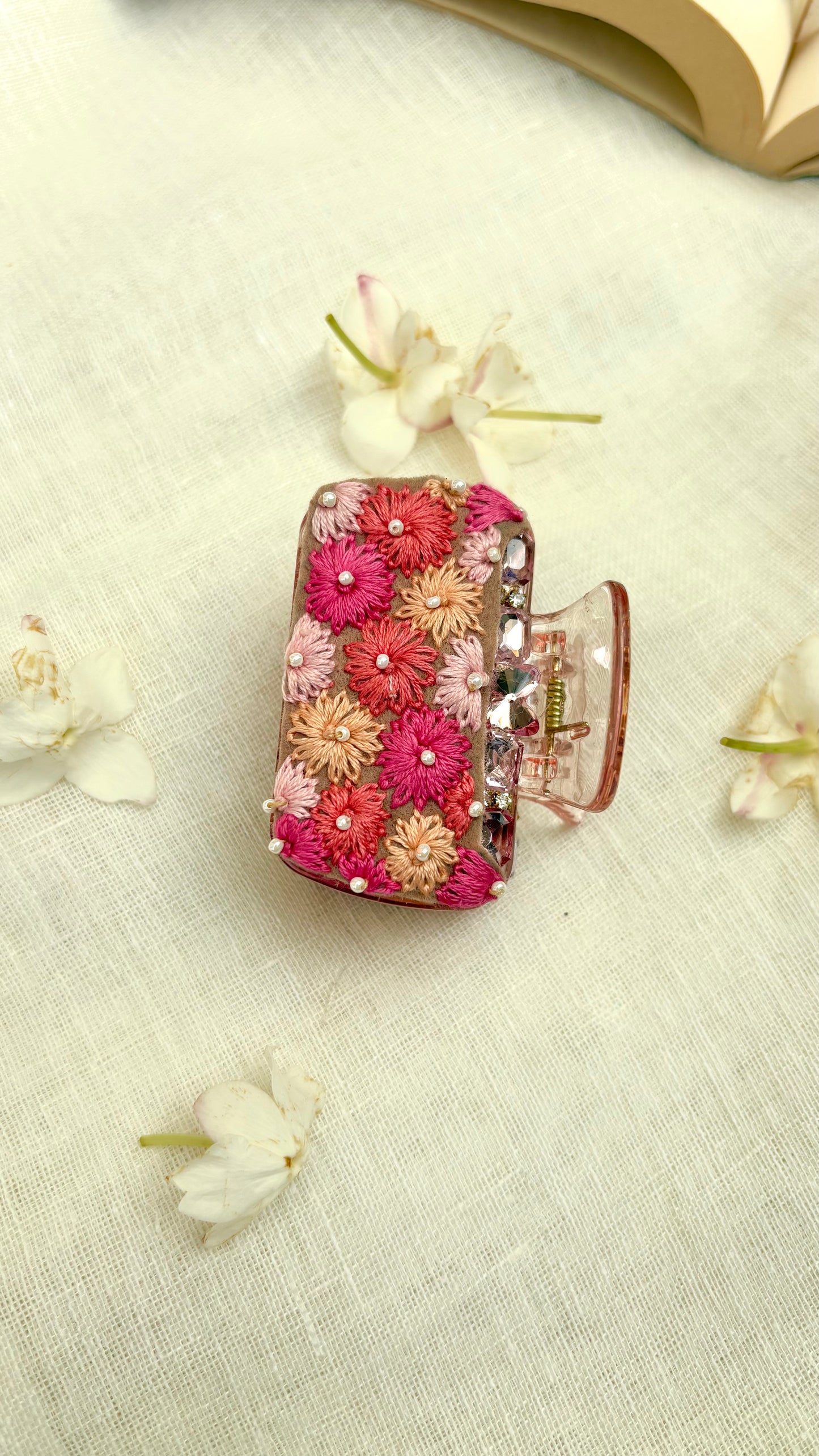 Embroidered clutcher